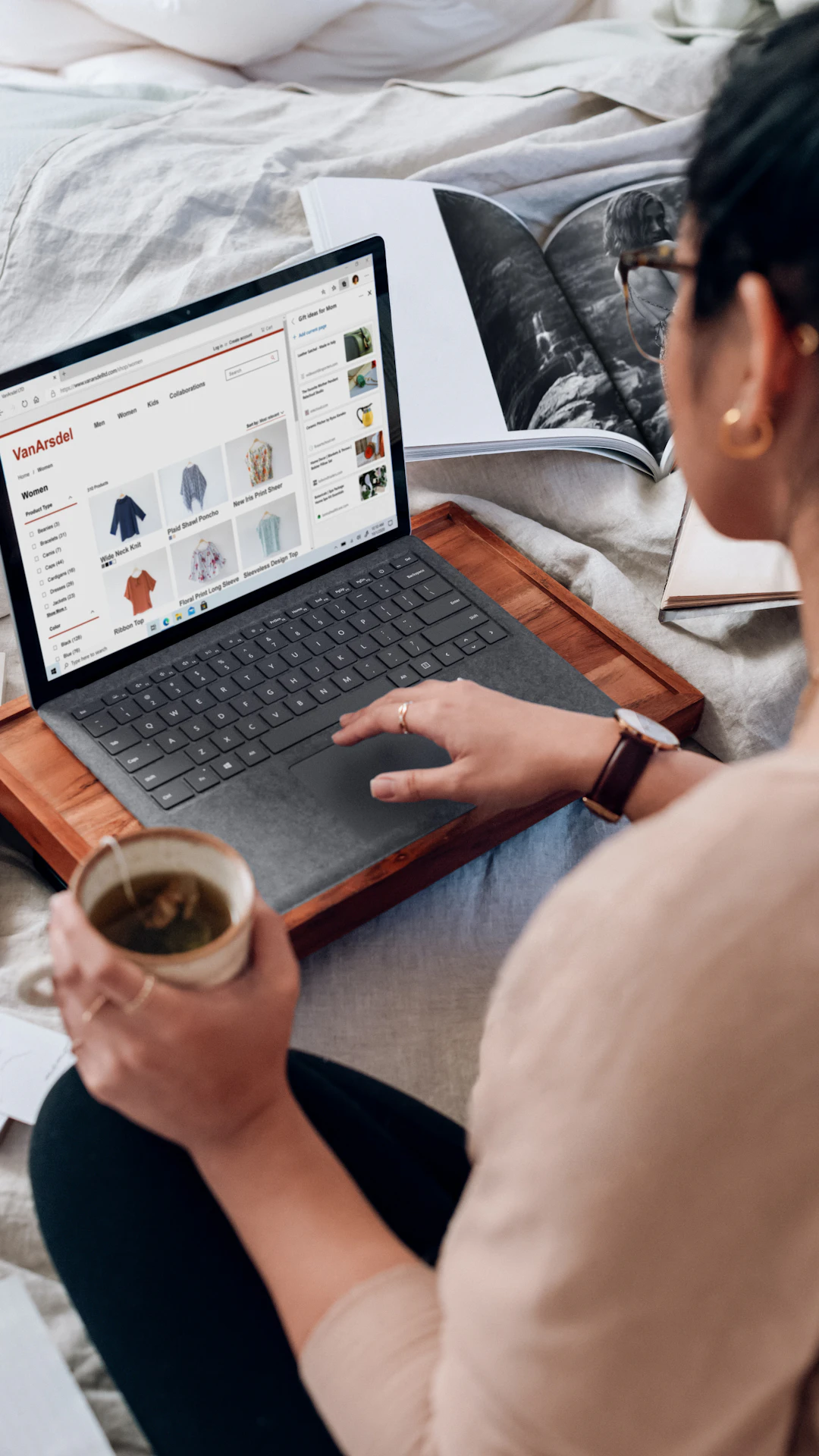 woman in white shirt using black laptop computer