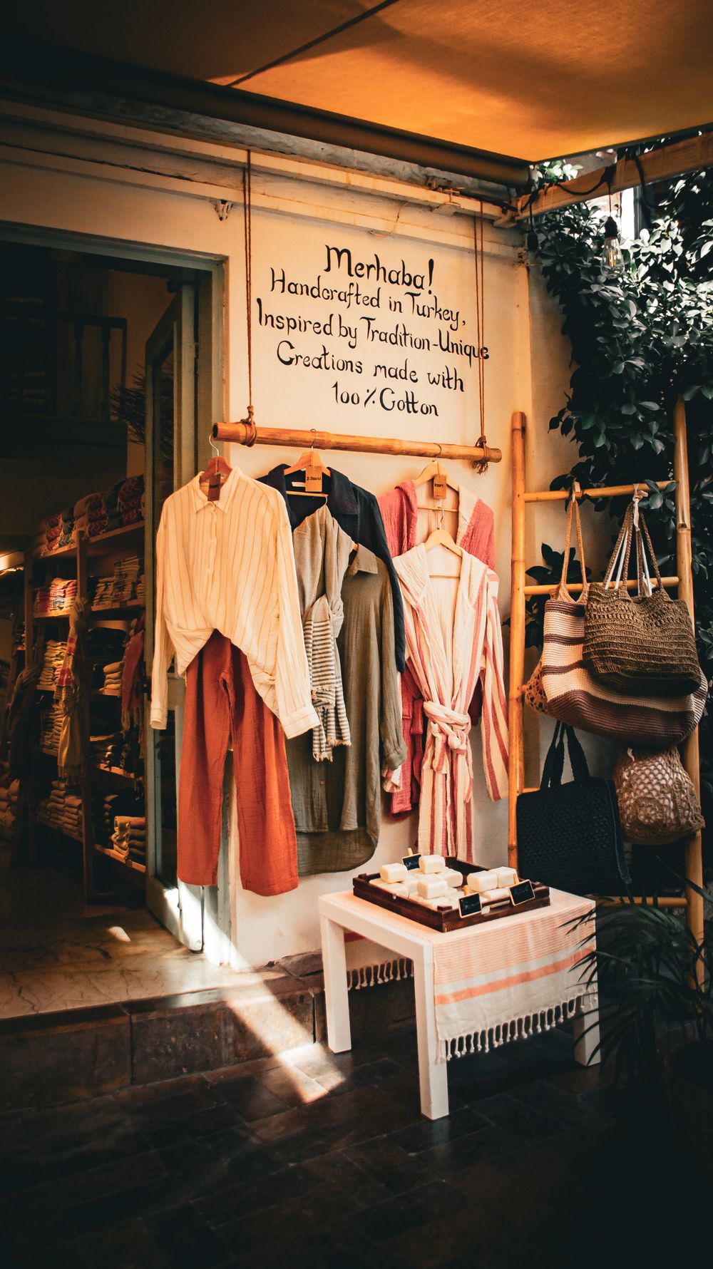 Cozy boutique showcasing handmade clothes and accessories, inspired by Turkish traditions.