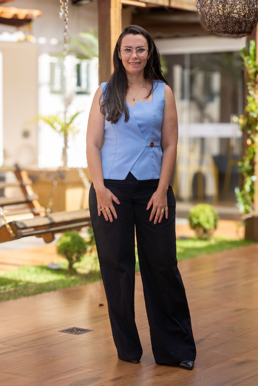 Confident woman in business attire posing outdoors in Tiros, Brazil.