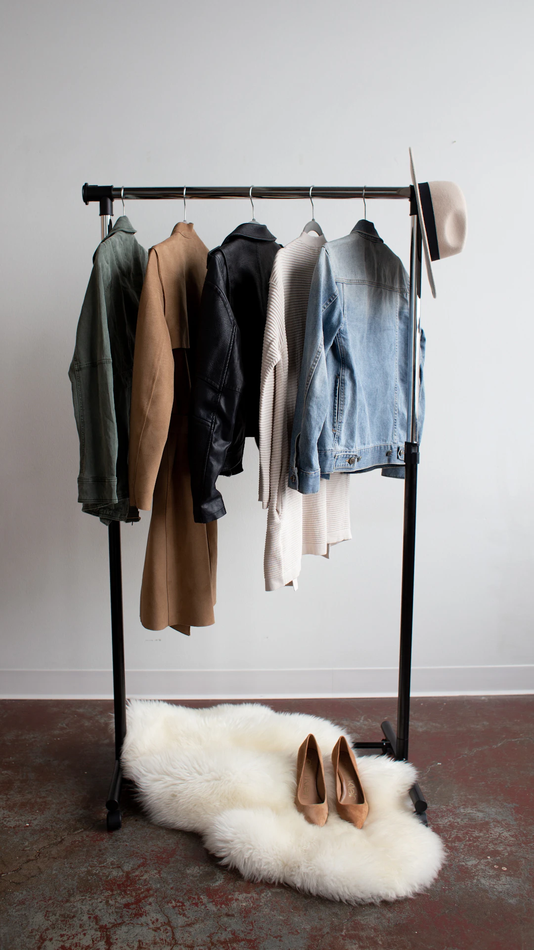 five jackets on clothes rack